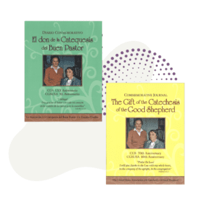 Two editions of the 40th Anniversary Commemorative Journal: one in Spanish titled "El don de la Catequesis del Buen Pastor," and one in English titled "The Gift of the Catechesis of the Good Shepherd." Both versions feature a photo of a woman and a man.